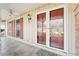 View of covered porch with ceiling fan at 4833 Village North Ct, Atlanta, GA 30338