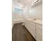 Bathroom with a shower and tub, vanity with a sink, and wood-look flooring at 105 Creekwood Ln, Fayetteville, GA 30214