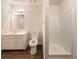 Bathroom featuring a vanity, toilet, and a glass-enclosed shower at 105 Creekwood Ln, Fayetteville, GA 30214
