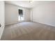 Bedroom with a large window and neutral carpeting at 105 Creekwood Ln, Fayetteville, GA 30214