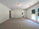 Bright bedroom with doors to the pool and neutral carpet at 105 Creekwood Ln, Fayetteville, GA 30214