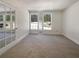 Bright bedroom featuring neutral carpet, double windows with natural light, and classic trim at 105 Creekwood Ln, Fayetteville, GA 30214