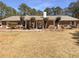 Charming single-story brick home with a well-maintained front yard and mature landscaping at 105 Creekwood Ln, Fayetteville, GA 30214
