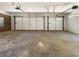 Two-car garage featuring two doors and concrete flooring at 105 Creekwood Ln, Fayetteville, GA 30214