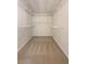 Walk-in closet with wall-mounted wire shelving and neutral carpeting at 105 Creekwood Ln, Fayetteville, GA 30214