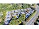 An aerial view of a community featuring multiple homes with gray roofs and mature trees at 1535 Duluth Hwy # 1001, Lawrenceville, GA 30043