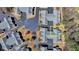 Aerial view of a home with a gray roof with mature trees in the community at 1535 Duluth Hwy # 1001, Lawrenceville, GA 30043