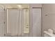 Bathroom with shower/tub combo with white tile, plus closet and towel bar at 1535 Duluth Hwy # 1001, Lawrenceville, GA 30043