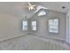 Bright bedroom with vaulted ceiling, carpeted floors, and multiple windows at 1535 Duluth Hwy # 1001, Lawrenceville, GA 30043
