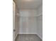 Walk-in closet with gray carpet and white wire shelving for optimal storage at 1535 Duluth Hwy # 1001, Lawrenceville, GA 30043