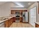 Bright kitchen with stainless steel appliances, wood cabinets, and hardwood floors at 1535 Duluth Hwy # 1001, Lawrenceville, GA 30043