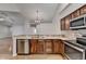 Updated kitchen features stainless steel appliances, granite counters, and wood cabinets at 1535 Duluth Hwy # 1001, Lawrenceville, GA 30043