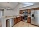 Updated kitchen features stainless steel appliances, granite counters, wood cabinets, and a breakfast bar at 1535 Duluth Hwy # 1001, Lawrenceville, GA 30043
