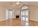 Spacious living room with hardwood floors, fireplace, vaulted ceilings and archway leading to a bright sunroom at 1535 Duluth Hwy # 1001, Lawrenceville, GA 30043