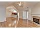 Bright living room boasts gleaming hardwood floors, a fireplace, and a view of the kitchen at 1535 Duluth Hwy # 1001, Lawrenceville, GA 30043