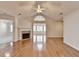 Bright living room boasts gleaming hardwood floors, a fireplace, and vaulted ceilings for an open feel at 1535 Duluth Hwy # 1001, Lawrenceville, GA 30043
