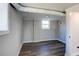 Basement with wood-look flooring, window, and gray wall paint at 2811 Birchwood Sw Ct, Marietta, GA 30060
