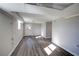 Basement featuring wood-look flooring, a suspended ceiling, natural light and gray wall paint at 2811 Birchwood Sw Ct, Marietta, GA 30060