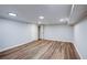 Spacious basement featuring wood-look flooring, recessed lighting, and white trim at 2811 Birchwood Sw Ct, Marietta, GA 30060