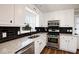 Modern kitchen with stainless appliances, granite countertops, subway tile backsplash, and new cabinets at 2811 Birchwood Sw Ct, Marietta, GA 30060