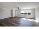 Sun-lit living area featuring new flooring, fresh paint, and a ceiling fan at 2811 Birchwood Sw Ct, Marietta, GA 30060