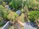 Aerial view of a home surrounded by mature trees, showcasing its spacious lot and private setting at 3040 Wax Wing Nw Ct, Kennesaw, GA 30144