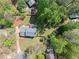 Overhead shot of home with mature trees and lush greenery, emphasizing its location at 3040 Wax Wing Nw Ct, Kennesaw, GA 30144