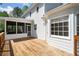 Back deck features wood flooring, a screened porch and white walls at 3040 Wax Wing Nw Ct, Kennesaw, GA 30144