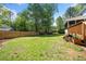 Expansive backyard space with a wooden fence, offering privacy and room for outdoor activities at 3040 Wax Wing Nw Ct, Kennesaw, GA 30144