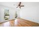Sun-filled bedroom featuring hardwood floors and two large windows at 3040 Wax Wing Nw Ct, Kennesaw, GA 30144