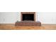 The living room's brick fireplace has a raised hearth and classic white mantle at 3040 Wax Wing Nw Ct, Kennesaw, GA 30144