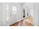 Bright and airy foyer with hardwood floors, decorative door glass, and plenty of natural light at 3040 Wax Wing Nw Ct, Kennesaw, GA 30144