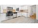 Bright kitchen featuring stainless steel appliances and plenty of counter space at 3040 Wax Wing Nw Ct, Kennesaw, GA 30144
