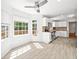 Bright eat-in kitchen with white cabinets, stainless appliances, and access to the rear deck at 3040 Wax Wing Nw Ct, Kennesaw, GA 30144