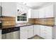 Bright kitchen features stainless steel appliances, granite countertops and a tiled backsplash at 3040 Wax Wing Nw Ct, Kennesaw, GA 30144