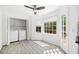 Sunlit laundry room with washer, dryer, ample storage, and bright windows overlooking the outdoor scenery at 3040 Wax Wing Nw Ct, Kennesaw, GA 30144