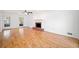 Spacious living room featuring a brick fireplace, hardwood floors, and natural light at 3040 Wax Wing Nw Ct, Kennesaw, GA 30144