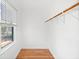 Walk-in closet with hardwood floors, a single wood rail and a window at 3040 Wax Wing Nw Ct, Kennesaw, GA 30144