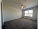 Spacious bedroom with a ceiling fan, and a window for natural light at 358 Azalea Cir, Cumming, GA 30040