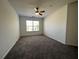 Bedroom with neutral carpet, a ceiling fan, and a window at 358 Azalea Cir, Cumming, GA 30040