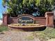 Beautiful Wynngate community brick sign with colorful flower bed, and mature trees at 358 Azalea Cir, Cumming, GA 30040