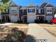 Charming townhomes with well-manicured lawns and driveways, creating a welcoming curb appeal at 358 Azalea Cir, Cumming, GA 30040