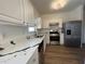 Bright kitchen with stainless appliances and stone countertops at 358 Azalea Cir, Cumming, GA 30040