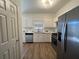 Modern kitchen featuring stainless appliances and white cabinets at 358 Azalea Cir, Cumming, GA 30040