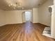 Spacious living room with fireplace, modern lighting, and wood floors at 358 Azalea Cir, Cumming, GA 30040