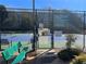 View of the community tennis court offering a recreation area for residents with court rules posted at 358 Azalea Cir, Cumming, GA 30040