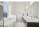 Spa-like bathroom with a dual sink vanity and soaking tub at 1200 Ponce De Leon Ne Ave # A1, Atlanta, GA 30306