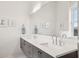 Modern bathroom with dual sinks, white countertops, and ample mirror space at 1200 Ponce De Leon Ne Ave # A1, Atlanta, GA 30306