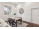 Bright dining area featuring a modern light fixture and large window at 1200 Ponce De Leon Ne Ave # A1, Atlanta, GA 30306