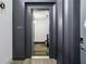 Modern entryway featuring dark trim, wood floors, and stylish unit A01 at 1200 Ponce De Leon Ne Ave # A1, Atlanta, GA 30306